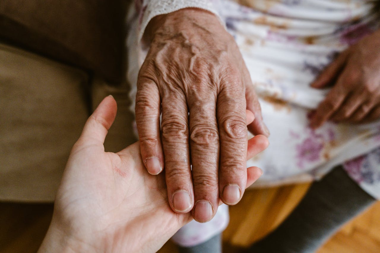 Close-up of elderly and young hands showing care and connection in Türkiye.